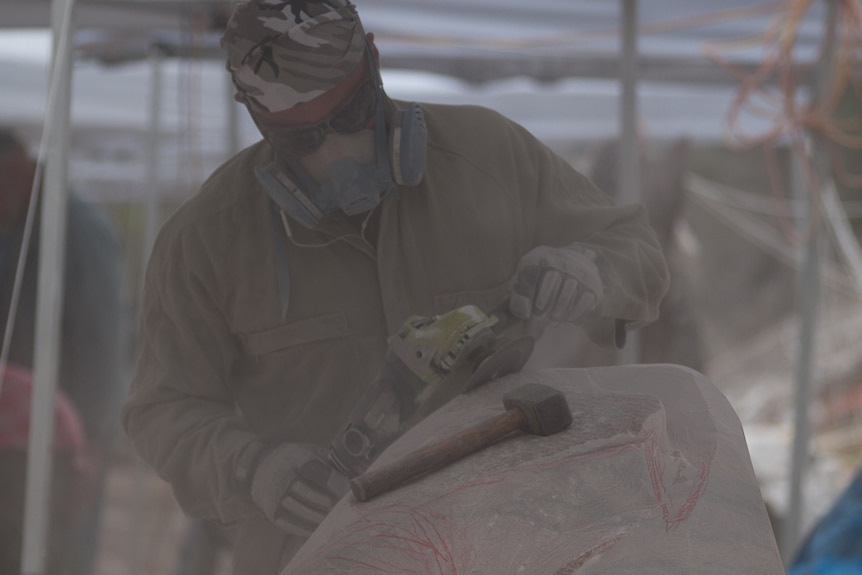 Peter Syndicas of Prospect gets dusty creating his stone artwork.