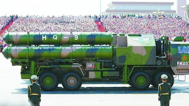 The green camouflaged missiles sit on a launch truck of the same colour.