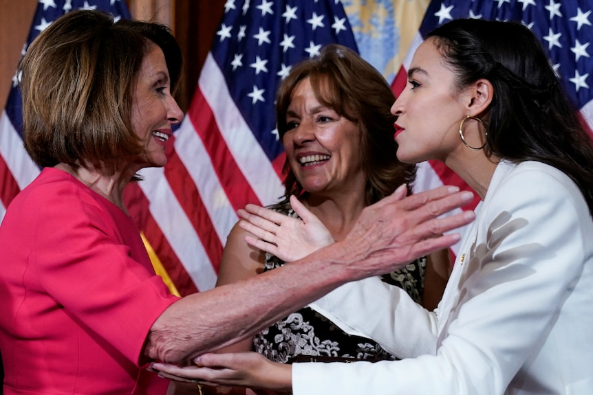 New York Democrat Alexandria Ocasio-Cortez greets Speaker of the House Nancy Pelosi.