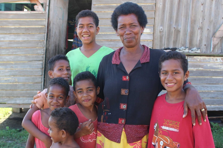 Asenaca Bainvalu with local kids