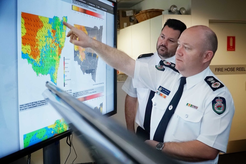 Two men looking at a map of NSW on a screen