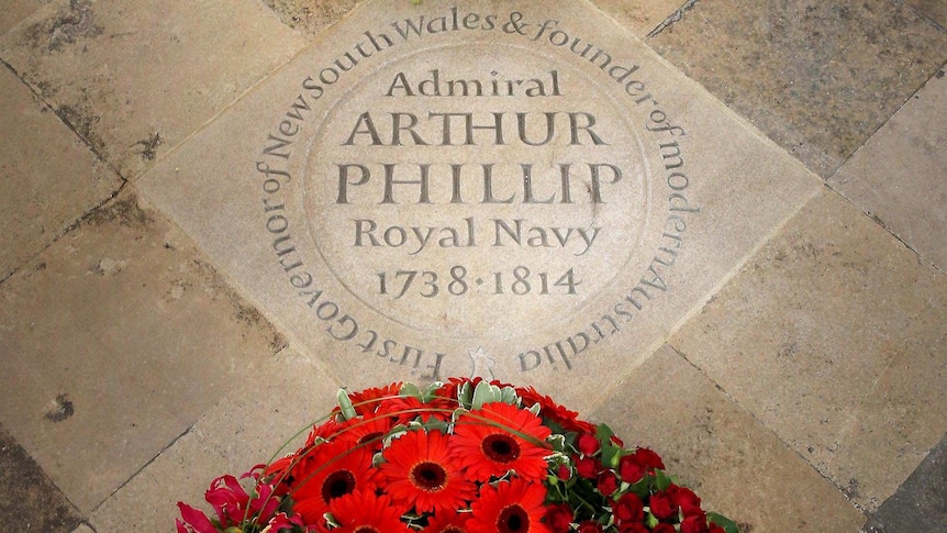 Wreaths surround a memorial stone to Admiral Arthur Philip at Westminster Abbey.