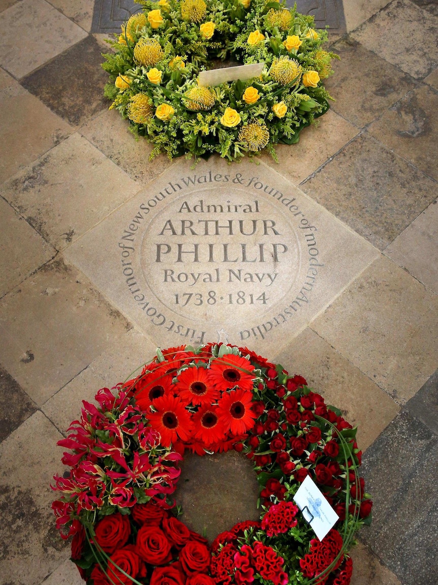 Wreaths surround a memorial stone to Admiral Arthur Philip at Westminster Abbey.