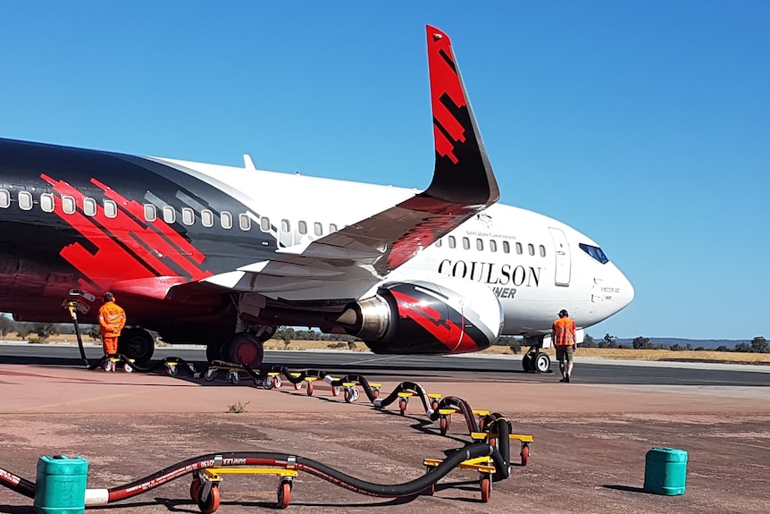 A Boeing 737 Fireliner large air tanker refuels on the runway at Busselton airport.