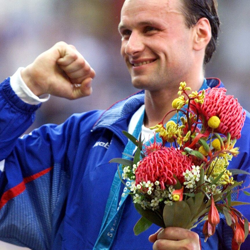 Dmitry Svatkovsky of Russia wears his gold medal for the men's modern pentathlon in the Sydney Olympics