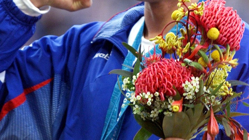 Dmitry Svatkovsky of Russia wears his gold medal for the men's modern pentathlon in the Sydney Olympics