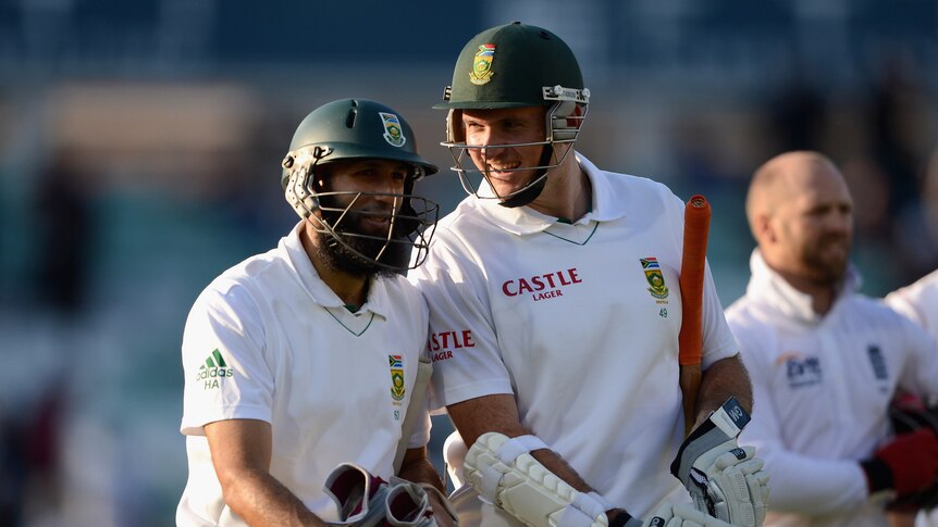 Key partnership ... Hashim Amla (L) and Graeme Smith leave the field at stumps on day two