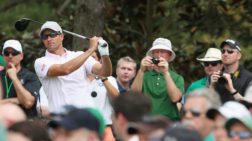 Feeling comfortable ... Adam Scott watches a tee shot during a practice round at Augusta