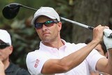 Feeling comfortable ... Adam Scott watches a tee shot during a practice round at Augusta