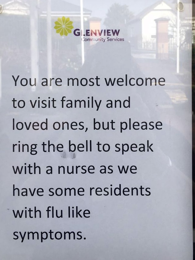 A sign at the Glenview front entrance asks visitors to speak to a nurse when entering, warning residents have flu-like symptoms.