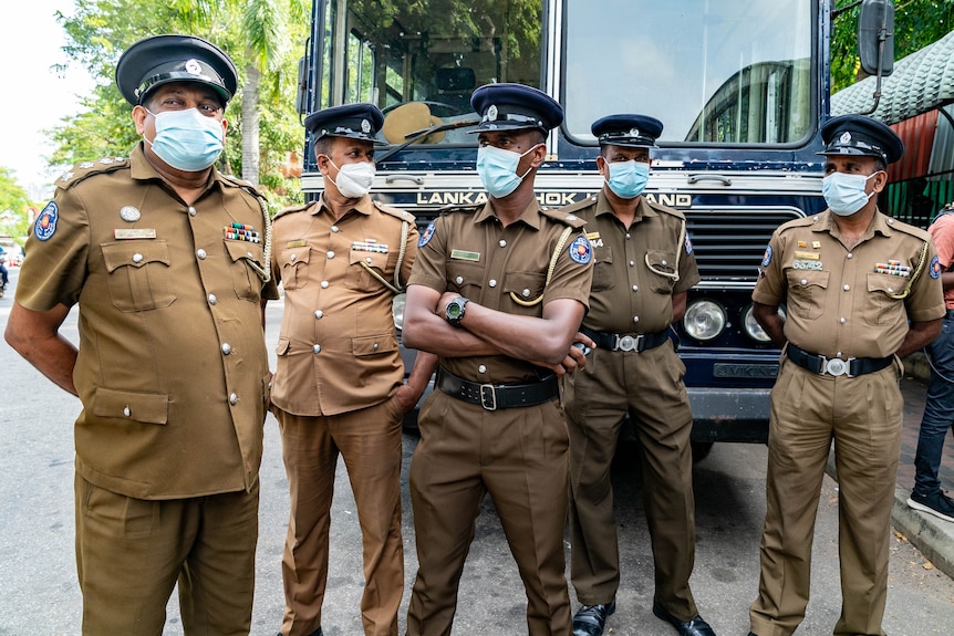 Police stand in a line.