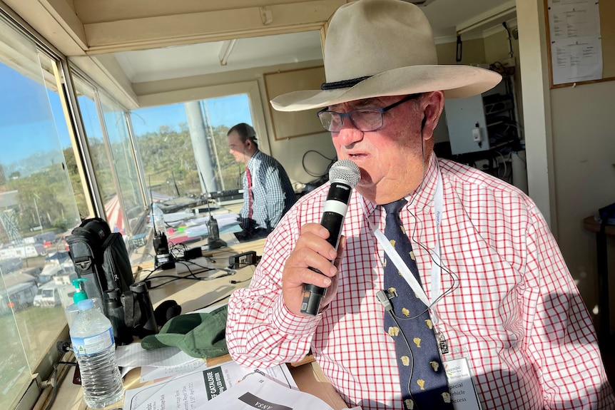 Man speaking into a microphone.