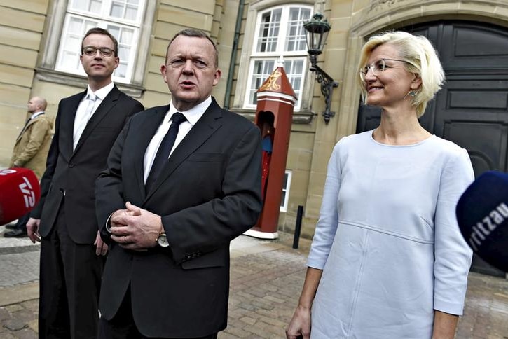 Danish Prime Minister Lars Lokke Rasmussen stands with Esben Lunde Larsen, left, and Ulla Tornaes, right