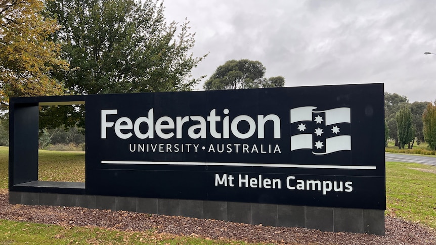 Signage for Federation University, Mt Helen Campus standing in green grass