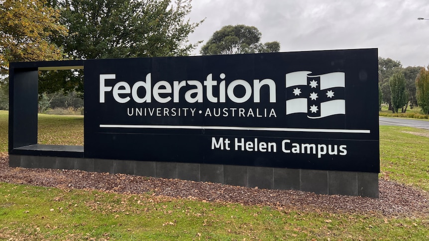 Signage for Federation University, Mt Helen Campus standing in green grass