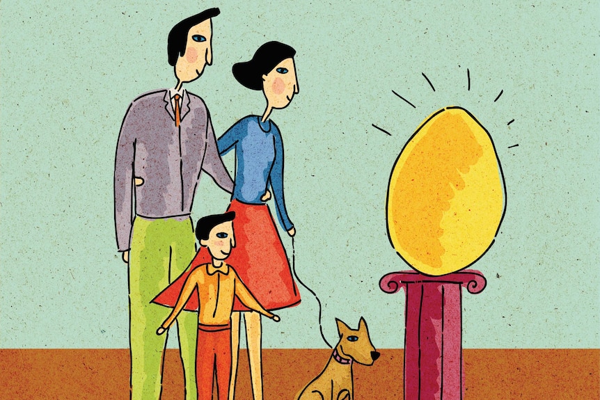 Family looking at giant golden egg on a pedestal.