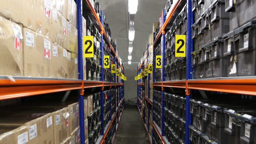 Floor to ceiling shelves stacked with seeds from around the world, inside the Global Seed Vault.