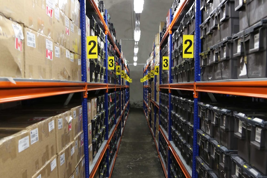 Floor to ceiling shelves stacked with seeds from around the world, inside the Global Seed Vault.