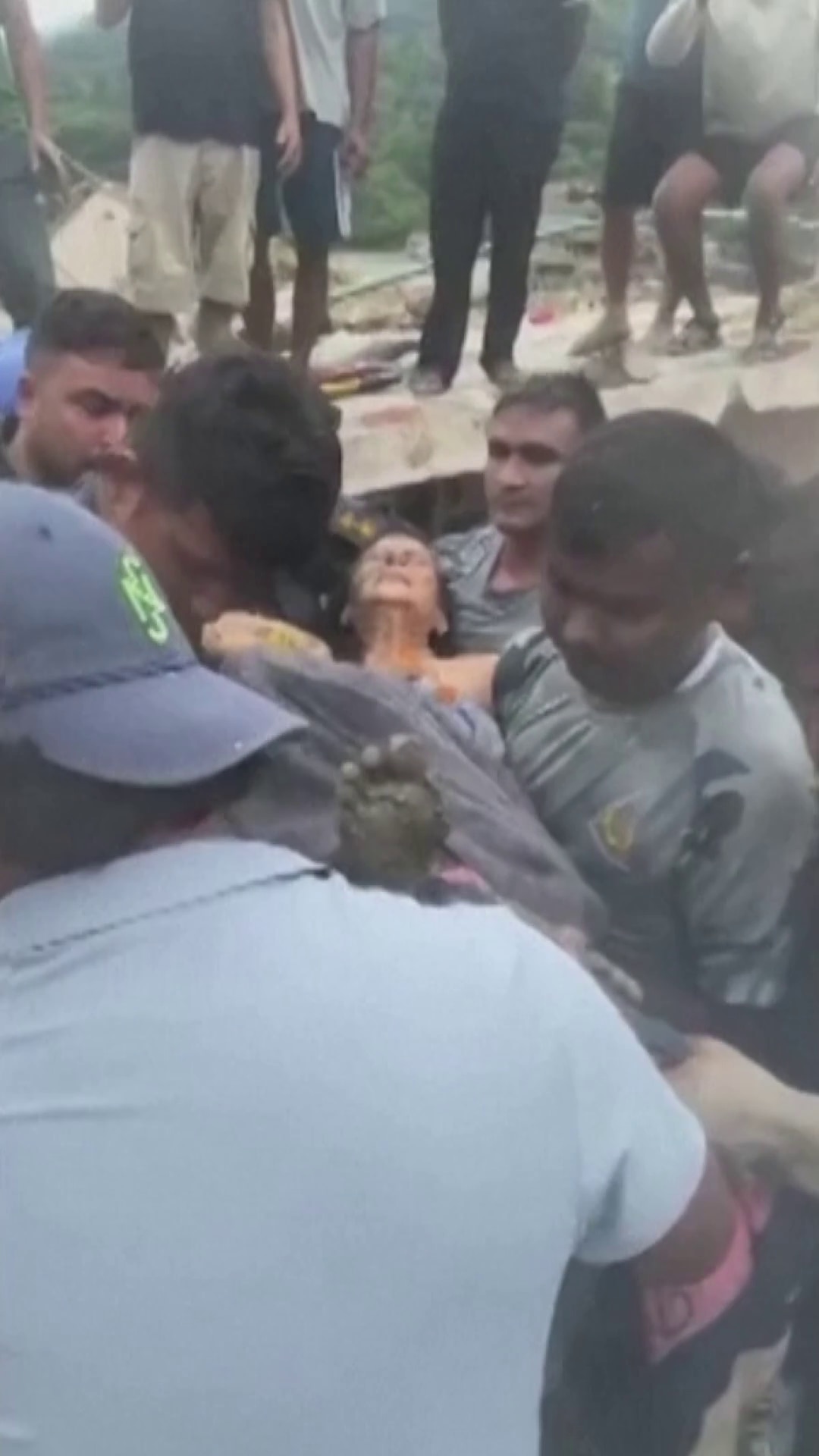 The moment a Nepali woman found alive days after devastating floods