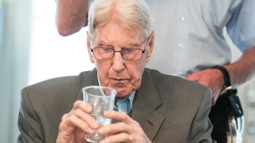 Auschwitz guard Reinhold Hanning attends a hearing in Germany