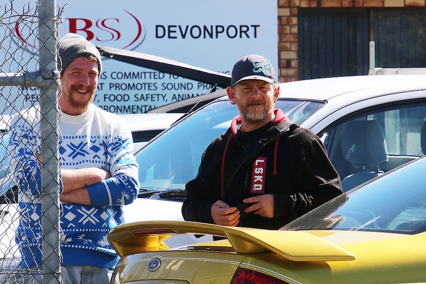 JBS abattoir employees James Ford (left) and Matthew Coventry outside the processing plant.