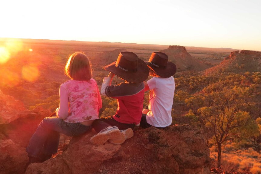 Children look out over the vast landscape of central western Queensland.