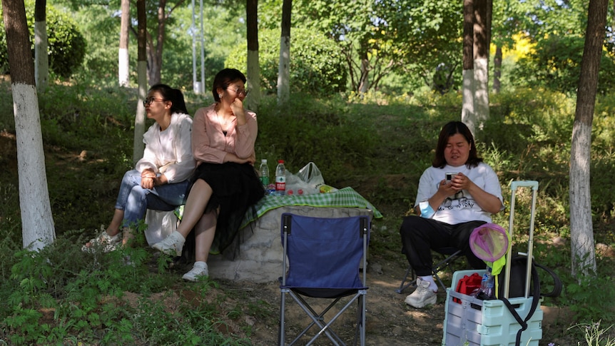 three Beijing residents camping and picnicking outdoors 