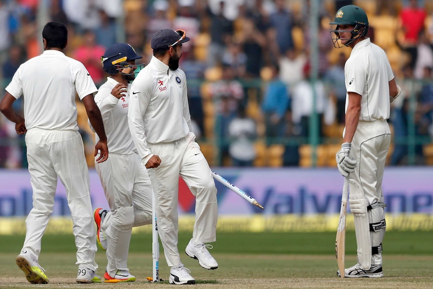 Virat Kohli (centre) gestures to Josh Hazlewood (right) during the 2017 Border-Gavaskar series in India.