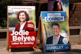 A-frame boards with campaign photos for political candidates Jodie Belyea and Nathan Conroy