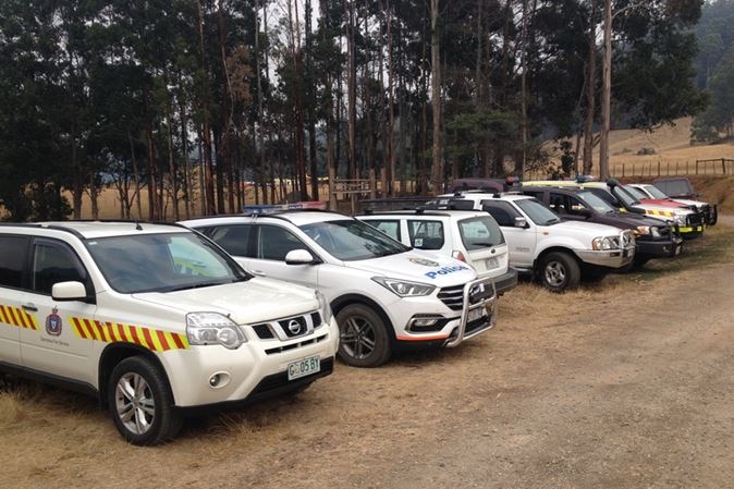 Emergency services vehicles lined up at the Vale airstrip during the height of Tasmania's 2016 bushfire emergency.