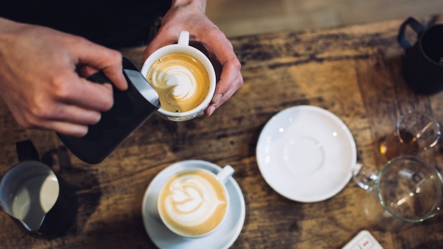 Coffee being poured into cup