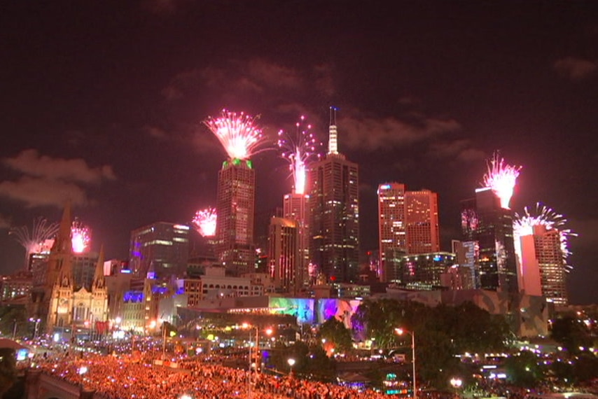 Fireworks are launched from buildings across Melbourne's CBD on New Year's Eve in 2016.