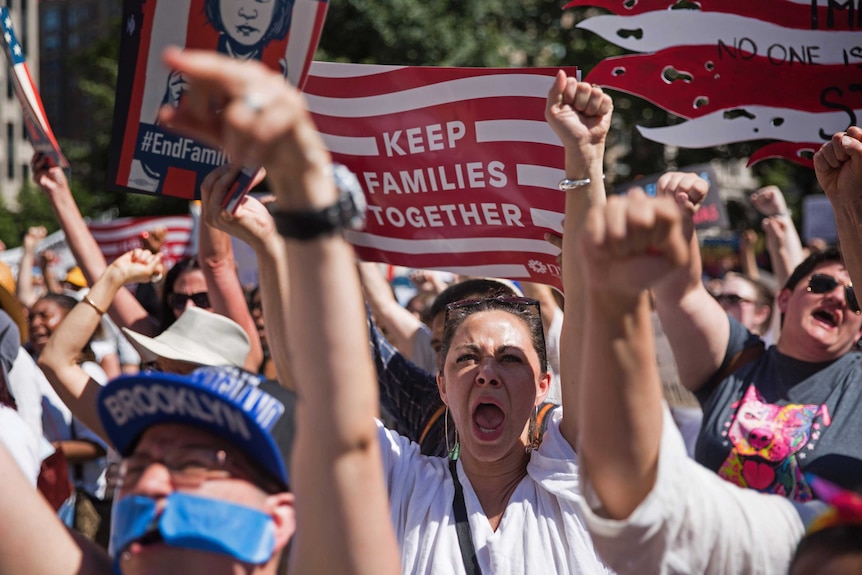 Activists shout during the rally to protest the Trump administration's immigration policies