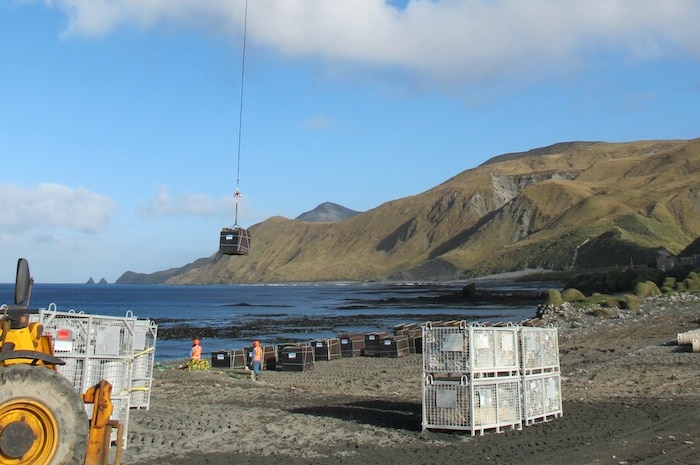 A helicopter drops supplies on Macquarie Island in the Southern Ocean