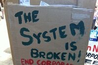 The System is broken protest sign