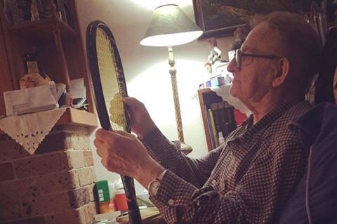 A picture of Nick Kyrgios's grandfather holding a tennis racquet.