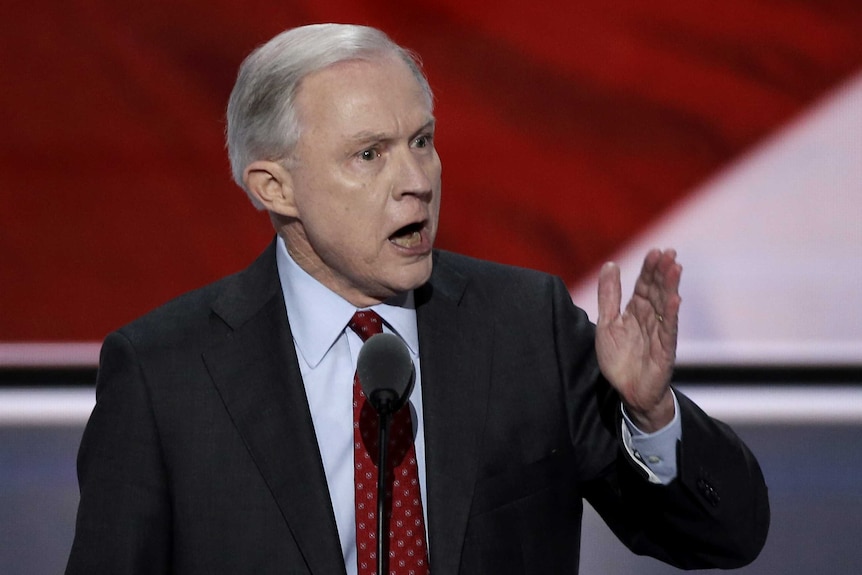 Senator Jeff Sessions points while making an address.