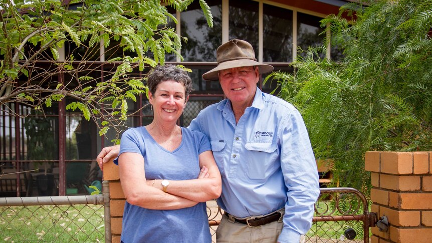 Graziers Michael and Sally Moody stand at their garden gate.