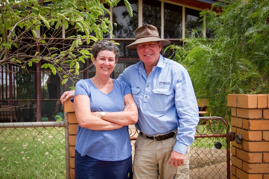 Graziers Michael and Sally Moody stand at their garden gate.