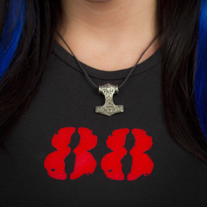 Cami Lynn, girlfriend of Detroit-based neo-Nazi Jeff Schoep, models "Thor's Hammer" pendant and white power t-shirt