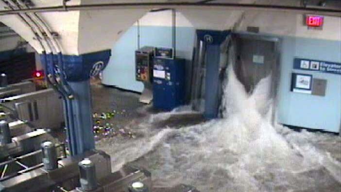 Floodwaters gush into the Hoboken underground railway station