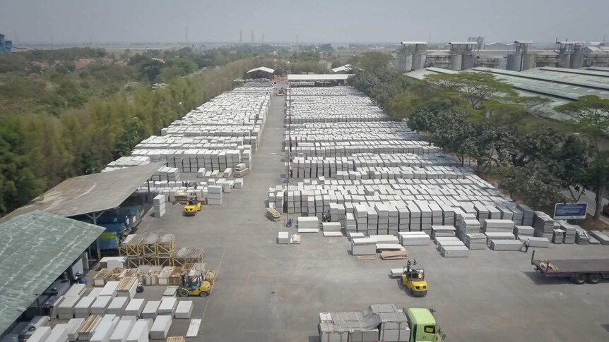 A drone shot of an Indonesian factory processing white asbestos for building materials