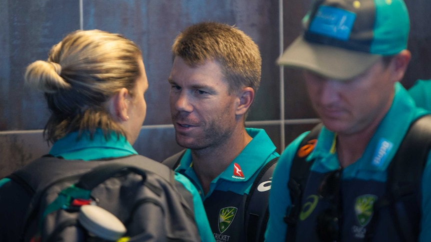 David Warner arrives with teammates at the Cape Town International airport.