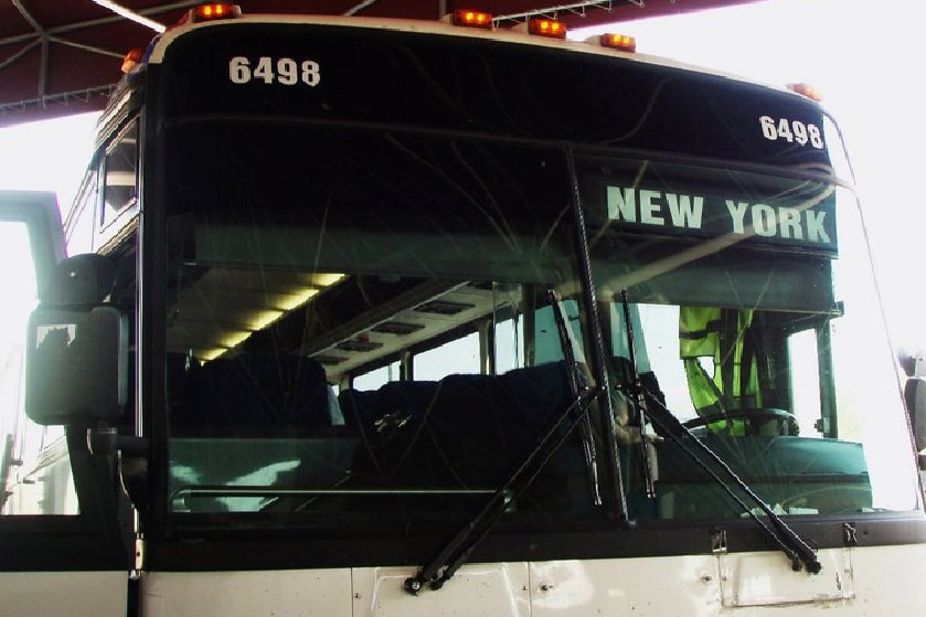 Photo of an old bus with a sign at the front saying 'New York'
