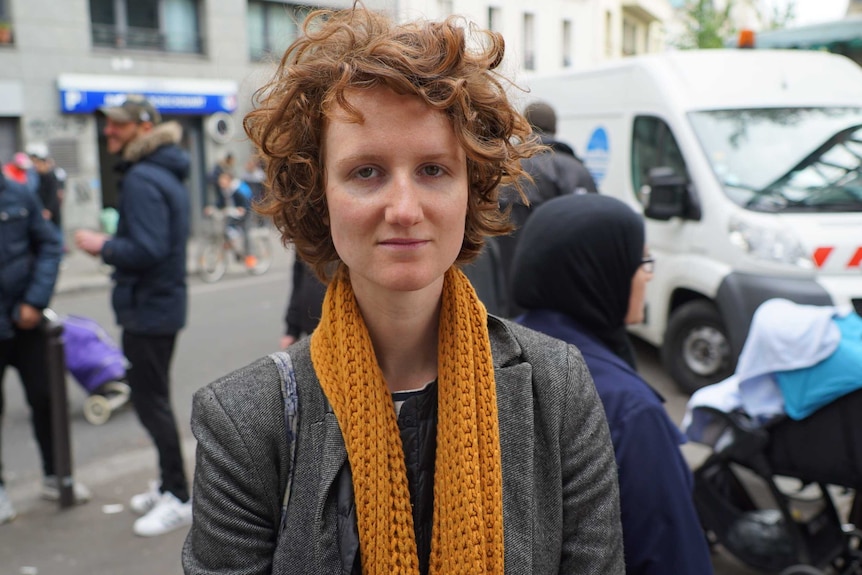 Elise Boutie stands in the Barbes Market and shares her thoughts on the French presidential race