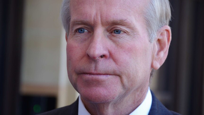 WA Premier Colin Barnett stands outside Parliament.