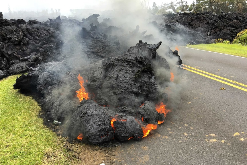 Lava spurts into the air at night