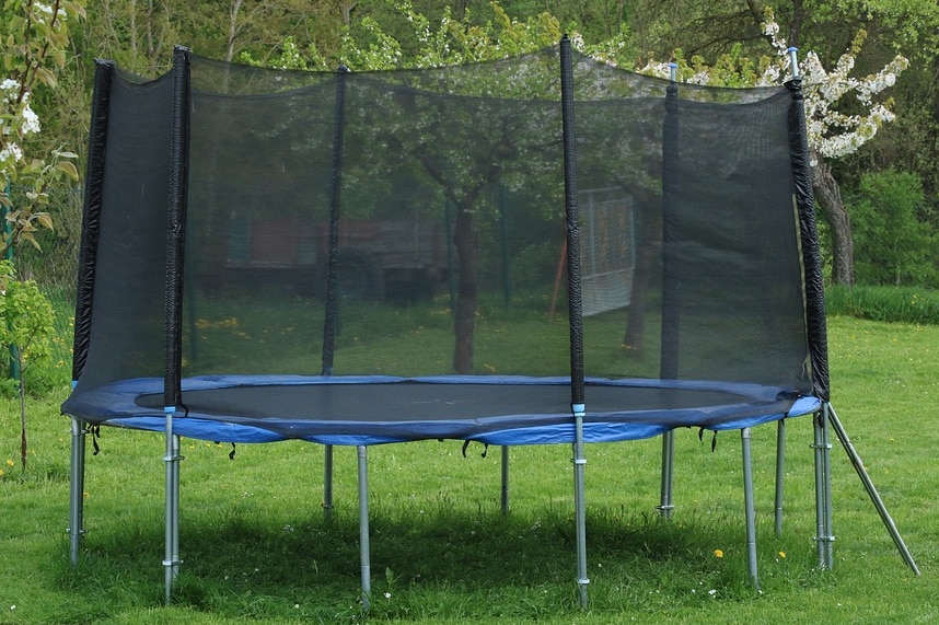 Trampoline in suburban backyard.