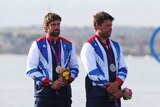 Andrew Simpson (R), on the medal podium at the London Olympics, died following a training accident in San Francisco