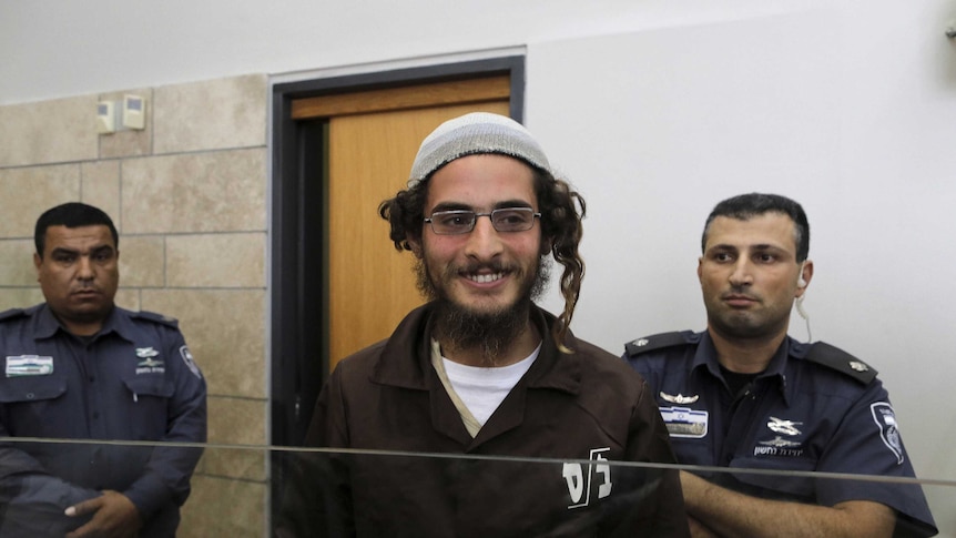 Meir Ettinger, the head of a Jewish extremist group and first person arrested, stands at the Israeli justice court in Nazareth, Israel.